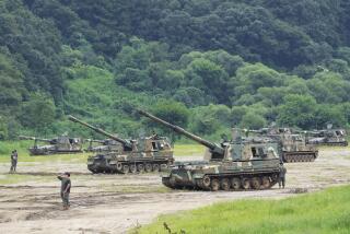 South Korean army K-9 self-propelled howitzers take positions in Paju, near the border with North Korea, South Korea, Monday, Aug. 22, 2022. The United States and South Korea began their biggest combined military training in years Monday as they heighten their defense posture against the growing North Korean nuclear threat. (AP Photo/Ahn Young-joon)