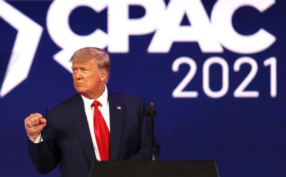 Former President Trump gestures to the crowd at the Conservative Political Action Conference in Orlando, Fla., on Feb. 28.