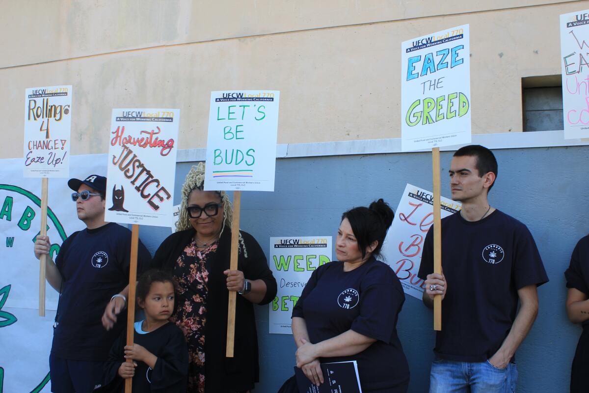 Unionized workers hold signs at cannabis delivery company Eaze 