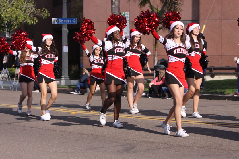La Jolla High School Vikings cheerleaders march in the La Jolla Christmas Parade.