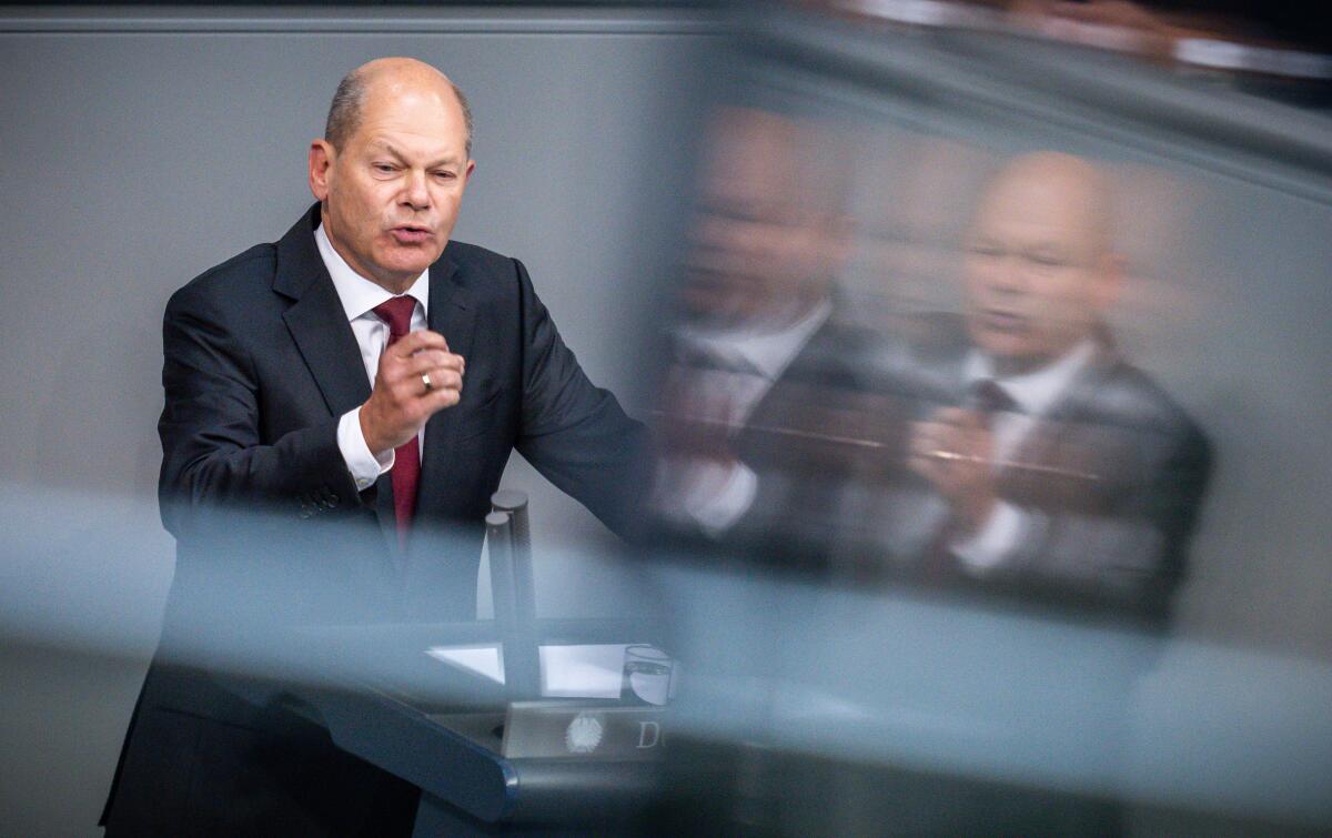 German Chancellor Olaf Scholz delivers a speech during a meeting of the German Federal Parliament, Bundestag, in the Reichstag building in Berlin, Germany, Wednesday, Sept. 7, 2022. (Michael Kappeler/dpa via AP)