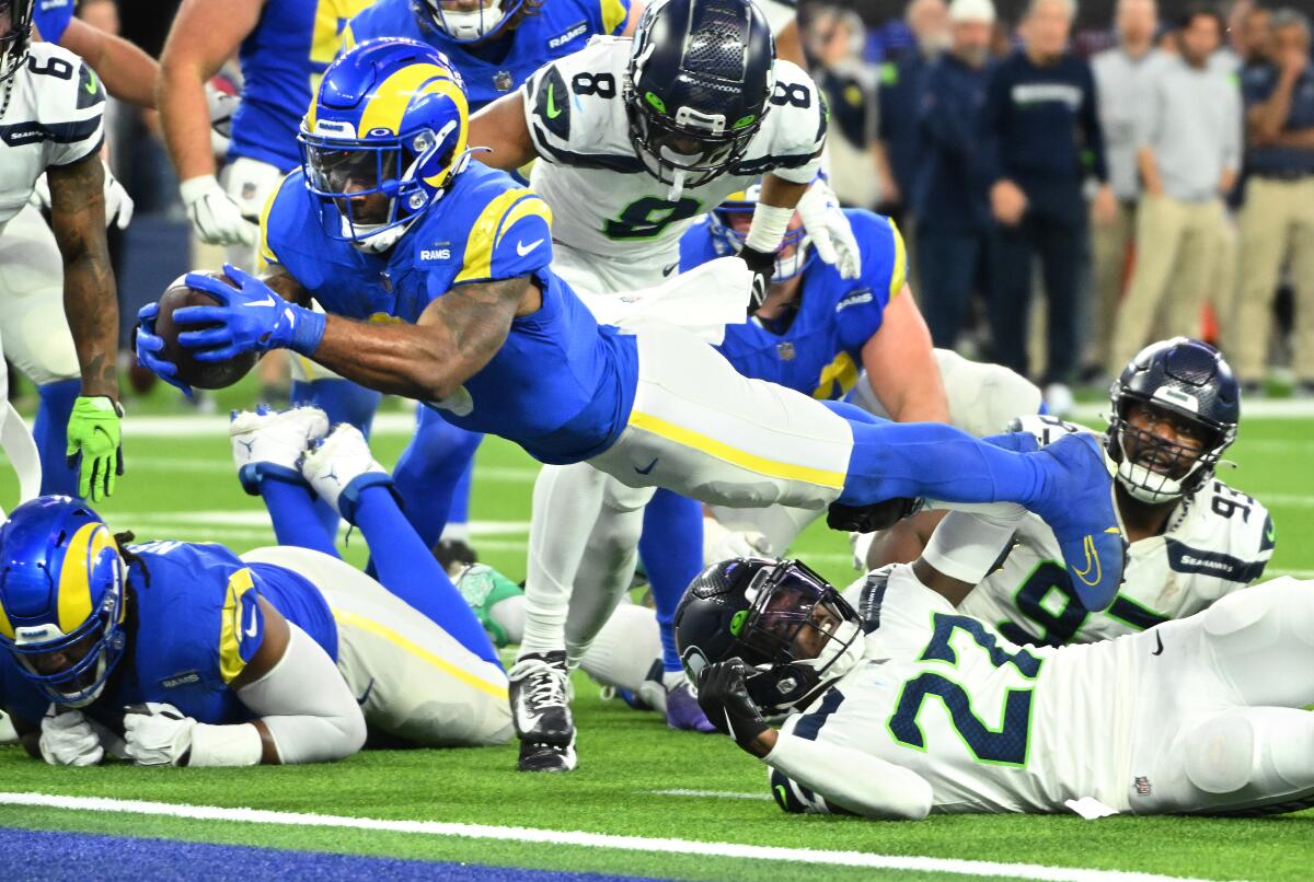 Rams running back Cam Akers dives for a touchdown against the Seahawks in December.