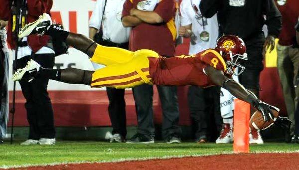 USC receiver Marqise Lee leaps for the end zone but falls short in the third overtime against Stanford on Saturday night at the Coliseum.
