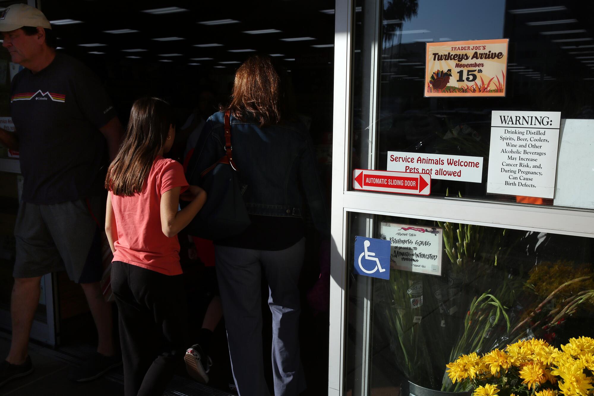 A Proposition 65 warning greets customers at the door at Trader Joe's in Glendale.