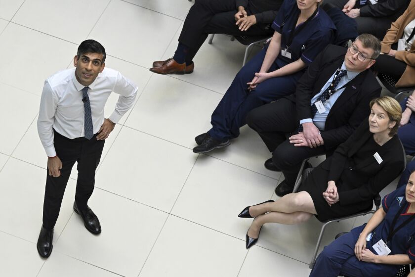 Britain's Prime Minister Rishi Sunak speaks with NHS Chief Executive Amanda Pritchard, right, in the audience during a Q&A session at Teesside University in Darlington, north-east England, Monday Jan. 30, 2023. (Oli Scarff/Pool via AP)