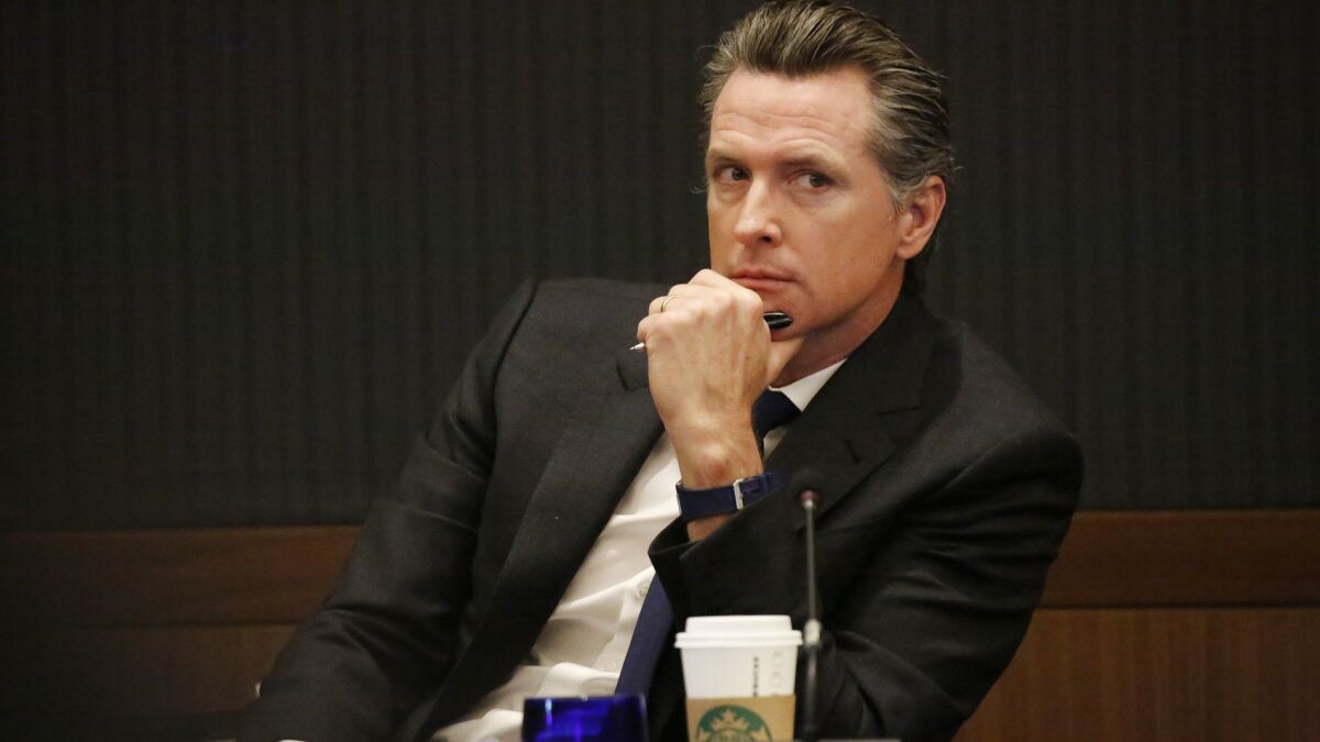 California Lt. Governor and University of California Regent Gavin Newsom listens to speakers during the UC Board of Regents meeting at UCLA on March 14.