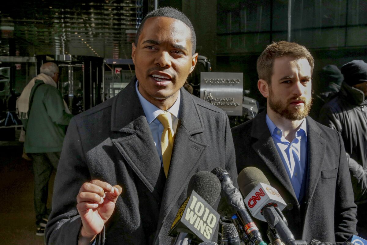 FILE - In this March 19, 2018 file photo, New York City Council Member Ritchie Torres, left, speaks at a news conference outside Kushner Companies headquarters, in New York, along with Housing Rights Initiative Executive Director Aaron Carr. Torres, who will be the first LGBTQ member of Congress from the Bronx if he wins the general election in November, defeated his closest rival for the nomination by more than 8,000 votes in results certified Tuesday, Aug. 4, 2020. (AP Photo/Richard Drew, File)