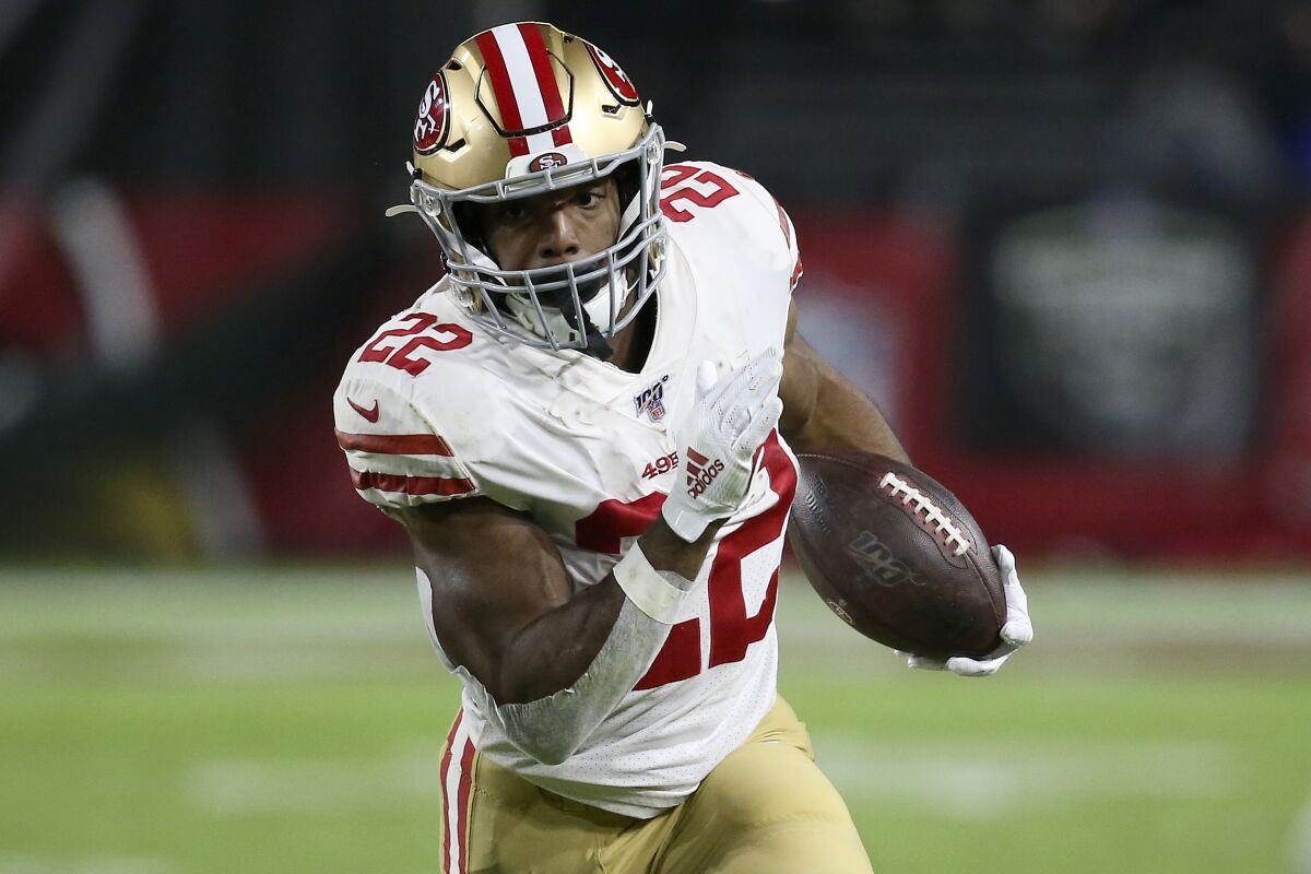 FILE - In this Oct. 31, 2019, file photo, San Francisco 49ers running back Matt Breida (22) carries the ball against the Arizona Cardinals during the first half of an NFL football game in Glendale, Ariz. The Dolphins believe veteran newcomers Jordan Howard and Matt Breida represent a significant upgrade at the position, providing more punch and versatility for an offense that last year had the NFL's lowest rushing total since 2006. (AP Photo/Ross D. Franklin, FIle)