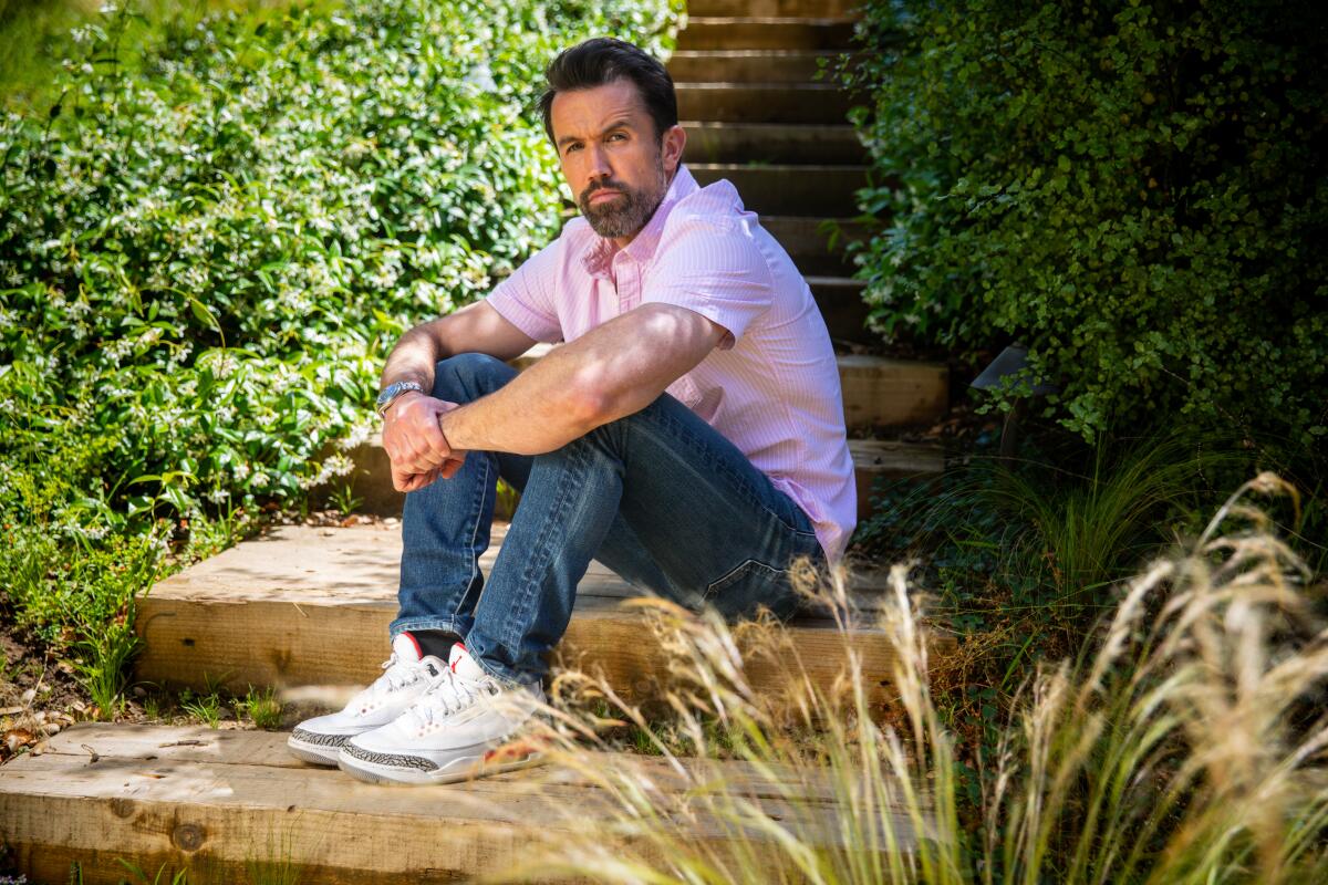 Rob McElhenney sits in the backyard of his Brentwood home.