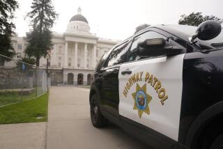 A California Highway Patrol vehicle is parked outside the state Capitol in Sacramento, Calif, Monday, Feb. 14, 2022. California Attorney General Rob Bonta says 54 current and former Highway Patrol Officers have been charge with racking up more than $226,000 in phony hours in an overtime fraud scheme. The charges, announced Thursday, Feb. 17, 2022, set from a criminal investigation of offices in the East Lost Angeles station. (AP Photo/Rich Pedroncelli)