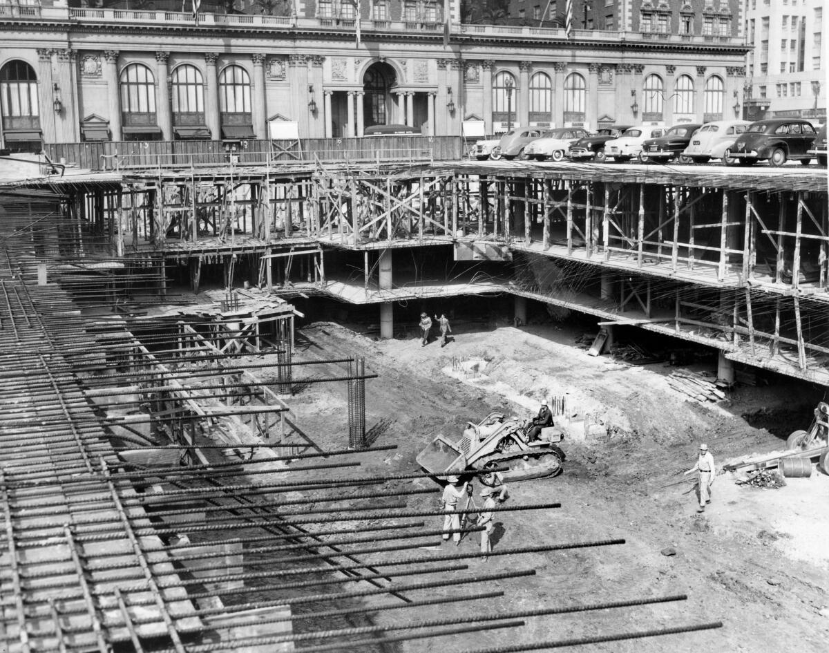 Construction of the underground parking garage at Pershing Square continues on Feb. 1, 1952. In the background is the Biltmore Hotel.