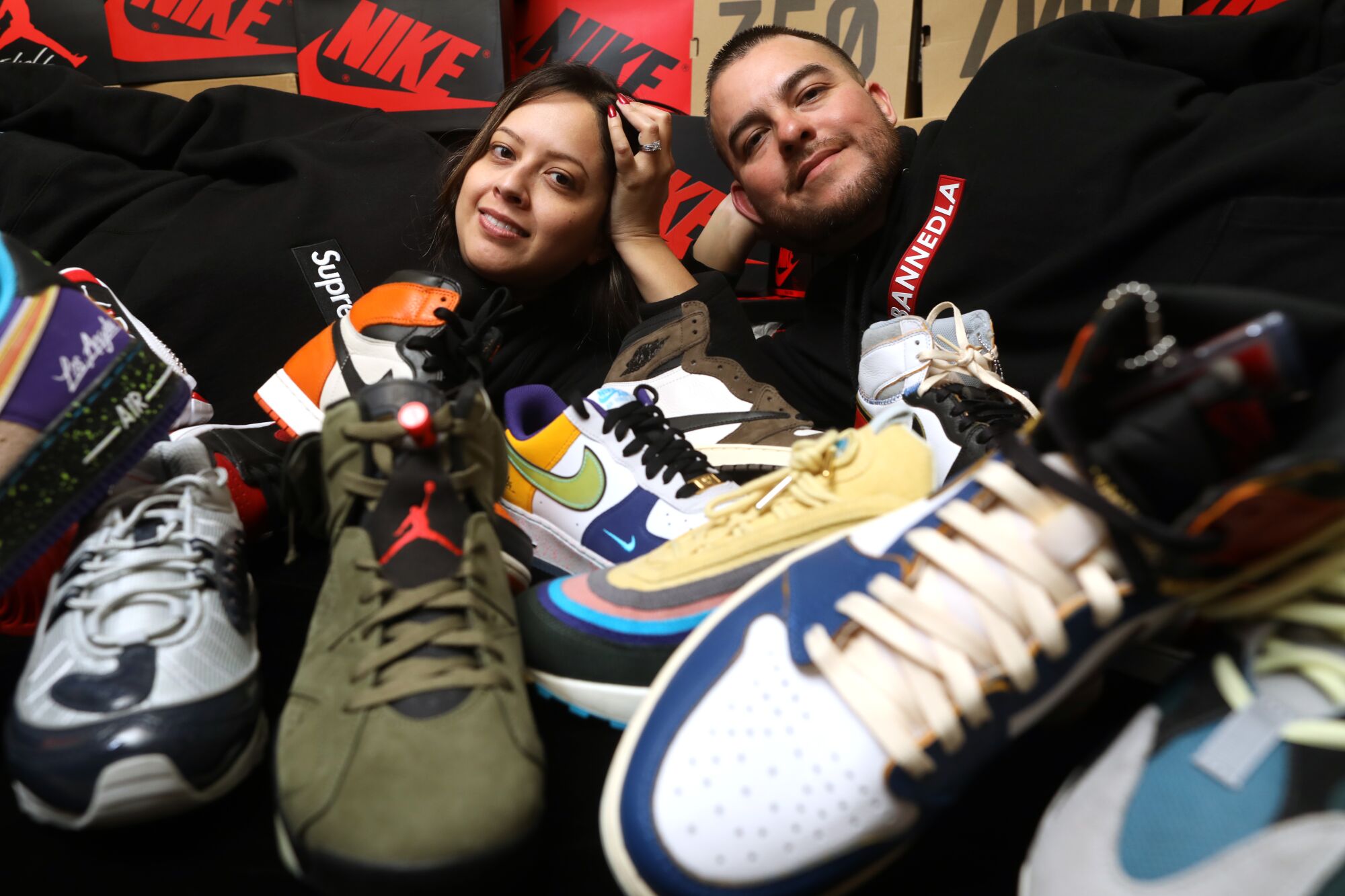 Vivian Velasquez, and her husband, Manny Cruz, with their sneaker collection in Paramount