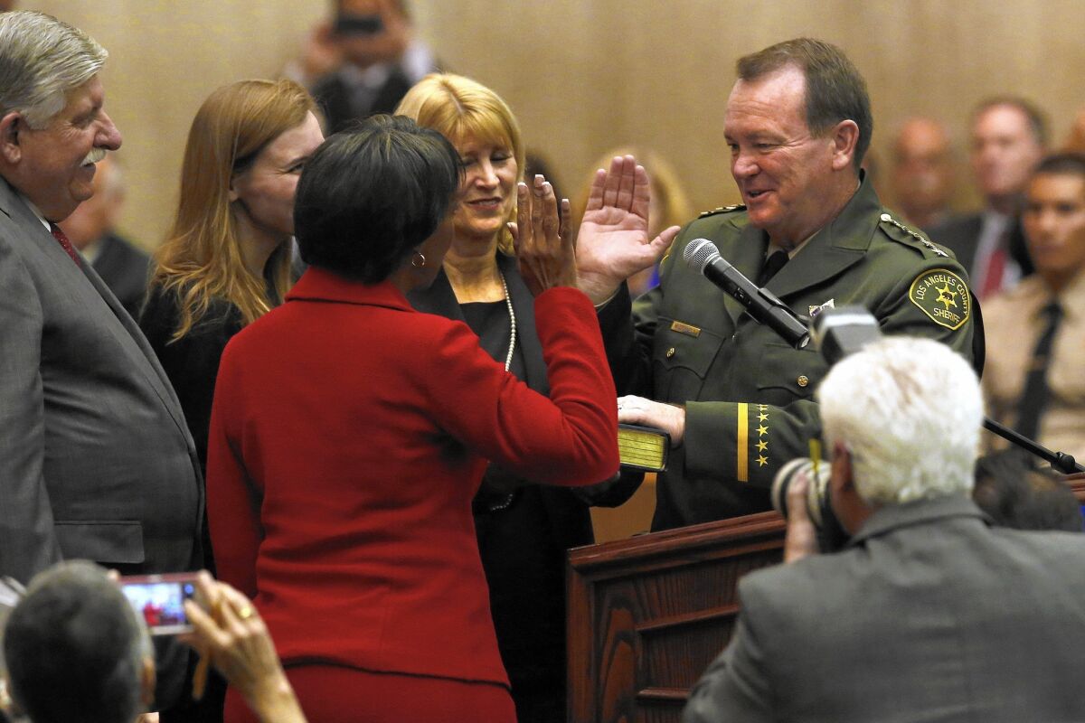 Sheriff Jim McDonnell is sworn in by Los Angeles County Dist. Atty. Jackie Lacey.