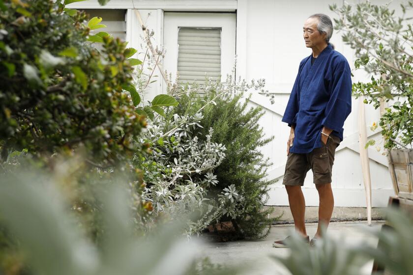 Georg Kochi is photographed at his Koreatown craftsman home.