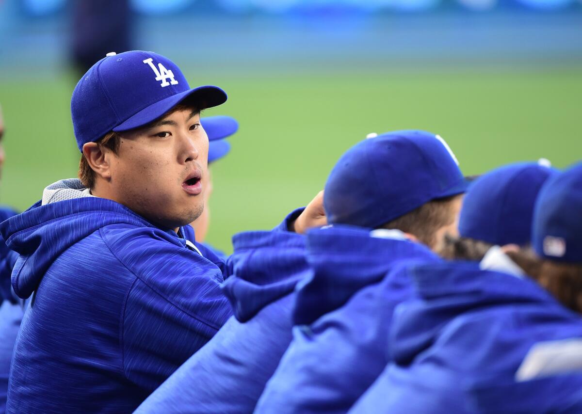 Dodgers pitcher Hyun-Jin Ryu (99) watches from the dugout before the game against the Mets on May 9.