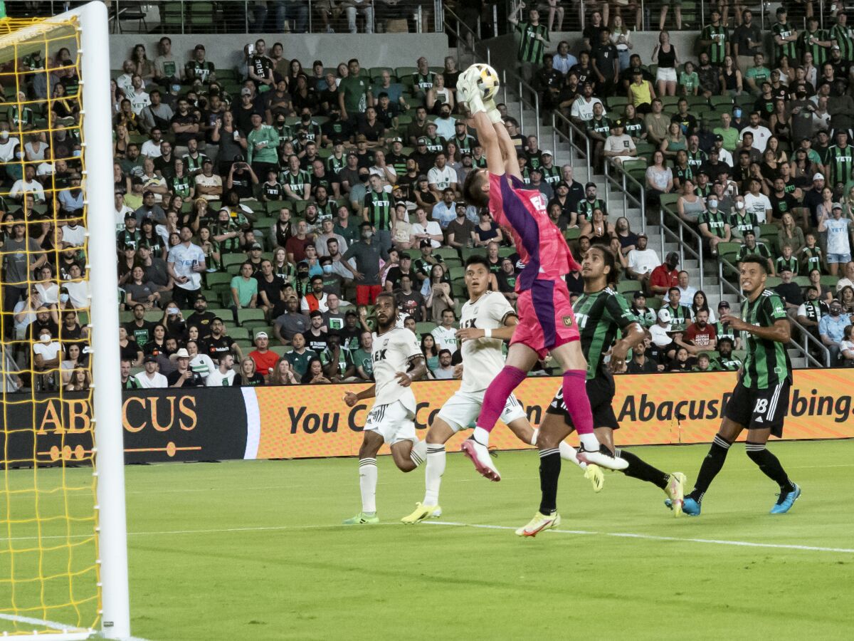 Los Angeles FC goalkeeper Tomas Romero goes up for a save during the first half of an MLS soccer match against Austin FC, Wednesday, Sept. 15, 2021, in Austin, Texas. (AP Photo/Michael Thomas)