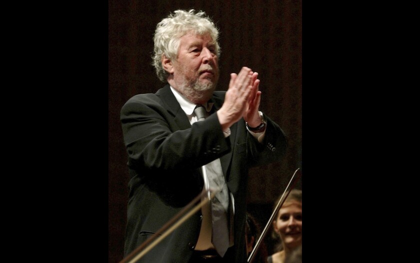 FILE - Composer Harrison Birtwistle, from Britain, congratulates Conductor Pierre Boulez from France and the Lucerne Festival Academy Orchestra, on Thursday, Sept 16, 2004, at the Lucerne Festival in the KKL Culture and Congress Centre in Lucerne, Switzerland. Birtwistle, widely recognized as one of Britain’s greatest contemporary composers, has died. He was 87. Birtwistle’s publisher, Boosey & Hawkes, said he died Monday, April 18, 2022, at his home in Mere, southwest England. No cause of death was given. Birtwistle created daringly experimental music that sometimes tried the patience of listeners. (AP Photo/Keystone, Sigi Tischler, File)