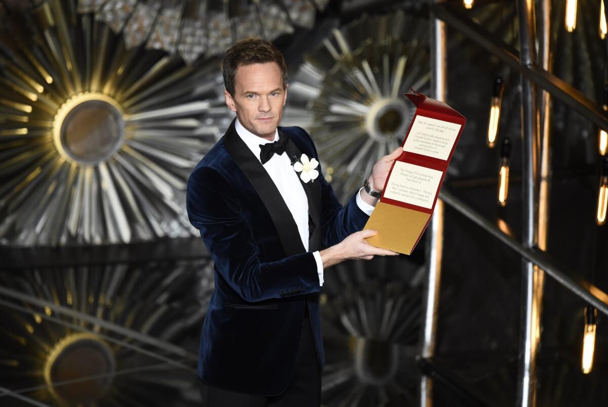 Host Neil Patrick Harris talks to the audience on stage at the 87th Academy Awards.