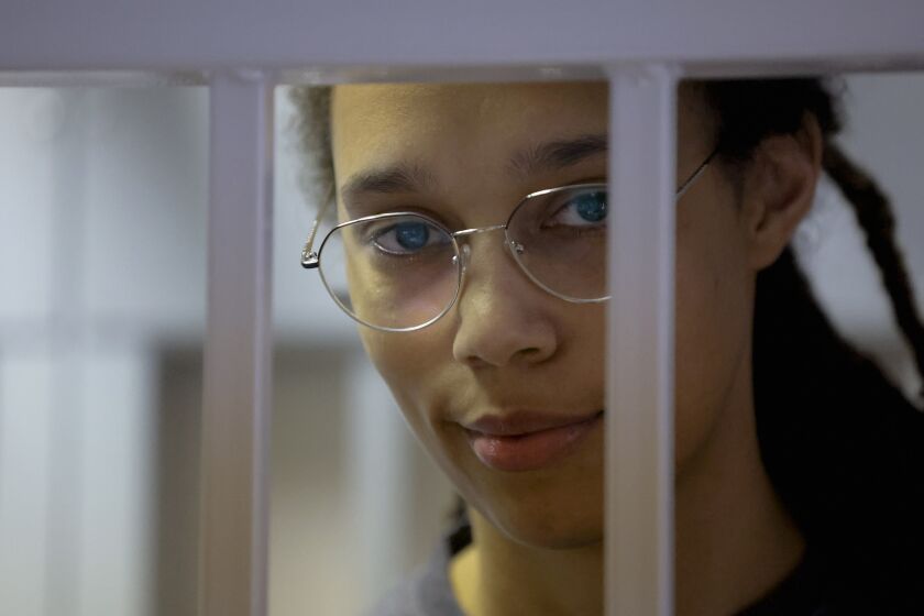 WNBA star and two-time Olympic gold medalist Brittney Griner stands in a cage in a courtroom prior to a hearing in Khimki just outside Moscow, Russia, Thursday, Aug. 4, 2022. Closing arguments in Brittney Griner's cannabis possession case are set for Thursday, nearly six months after the American basketball star was arrested at a Moscow airport in a case that reached the highest levels of US-Russia diplomacy. (Evgenia Novozhenina/Pool Photo via AP)