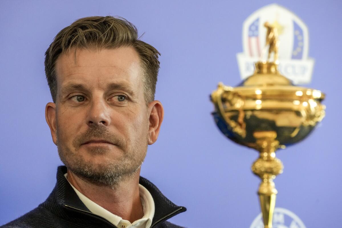 FILE - Henrik Stenson looks at the Ryder Cup Trophy during a press conference, at the Marco Simone golf club, in Guidonia Montecelio, outskirts of Rome, Italy, Monday, May 30, 2022. Stenson was removed as Ryder Cup captain for Europe, Wednesday, July 20, 2022, choosing guaranteed money offered by a Saudi-funded rival league over leading his team in the most celebrated event on the European tour schedule .(AP Photo/Andrew Medichini, File)