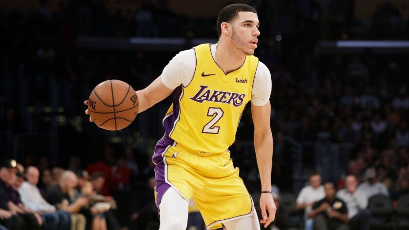 The Lakers' Lonzo Ball dribbles the ball during the first half of a game against the San Antonio Spurs on Jan. 11.