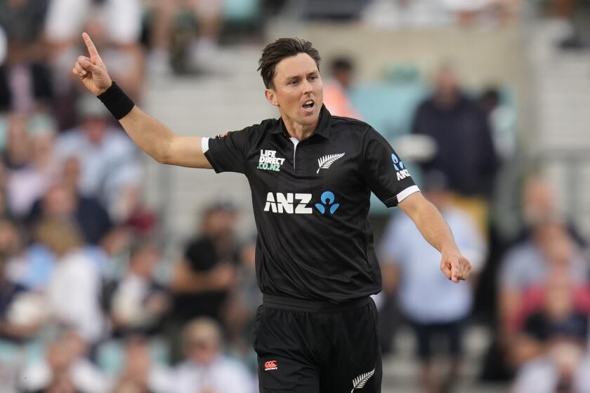 New Zealand's Trent Boult celebrates as England are bowled out for 368 during the One Day International cricket match between England and New Zealand at The Oval cricket ground in London, Wednesday, Sept. 13, 2023. (AP Photo/Kirsty Wigglesworth)