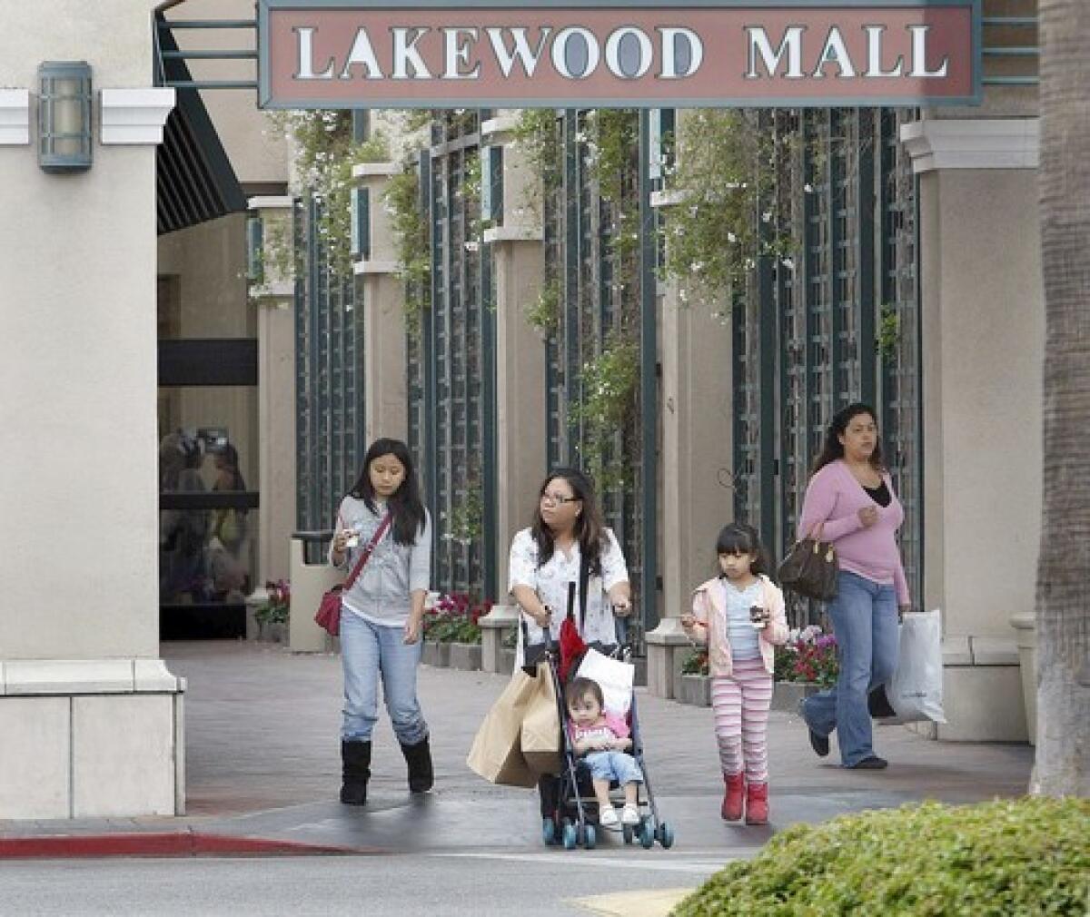 Shoppers leave Lakewood Mall in the traditionally white city north of Long Beach. Since 2000 the Asian population has increased 17% and the Latino population 20%.