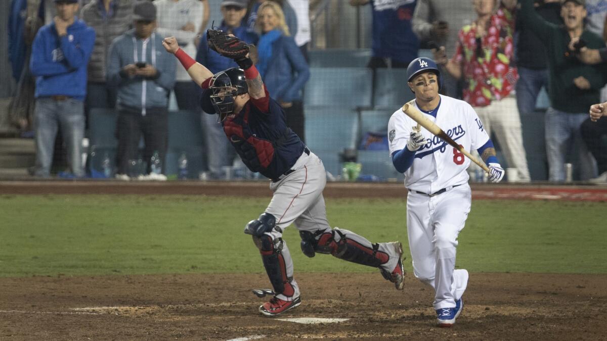 Boston Red Sox catcher Christian Vazquez celebrates immediately after Dodgers shortstop Manny Machado strikes out to end the World Series.