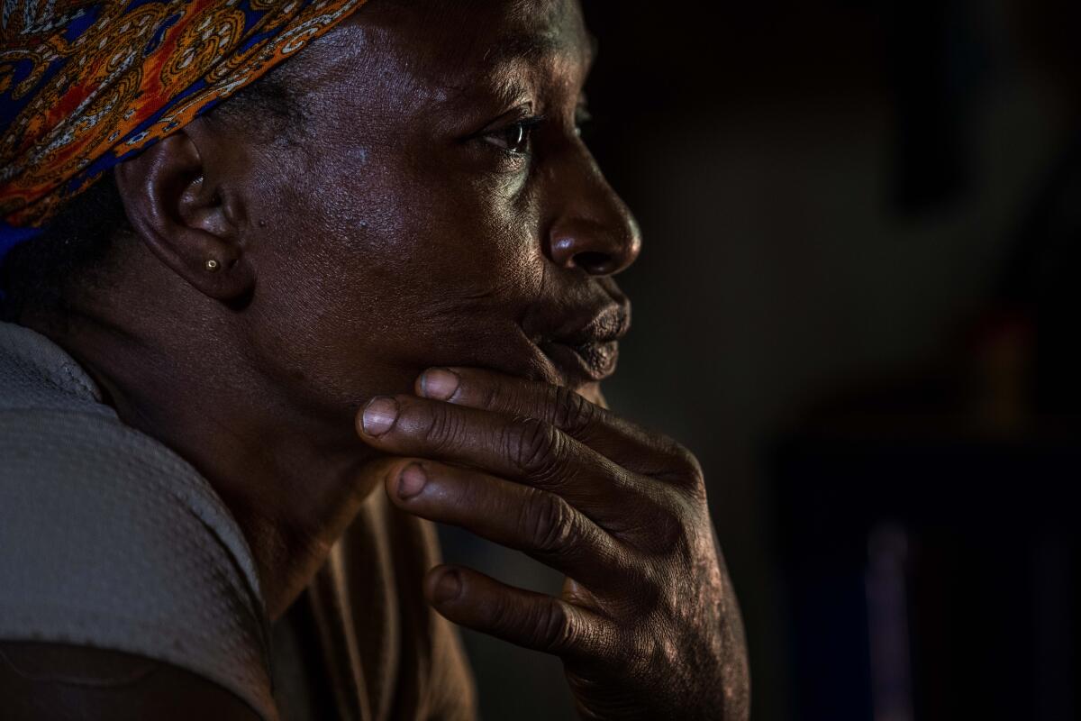 A woman sits on her bed in Umuida, Nigeria.