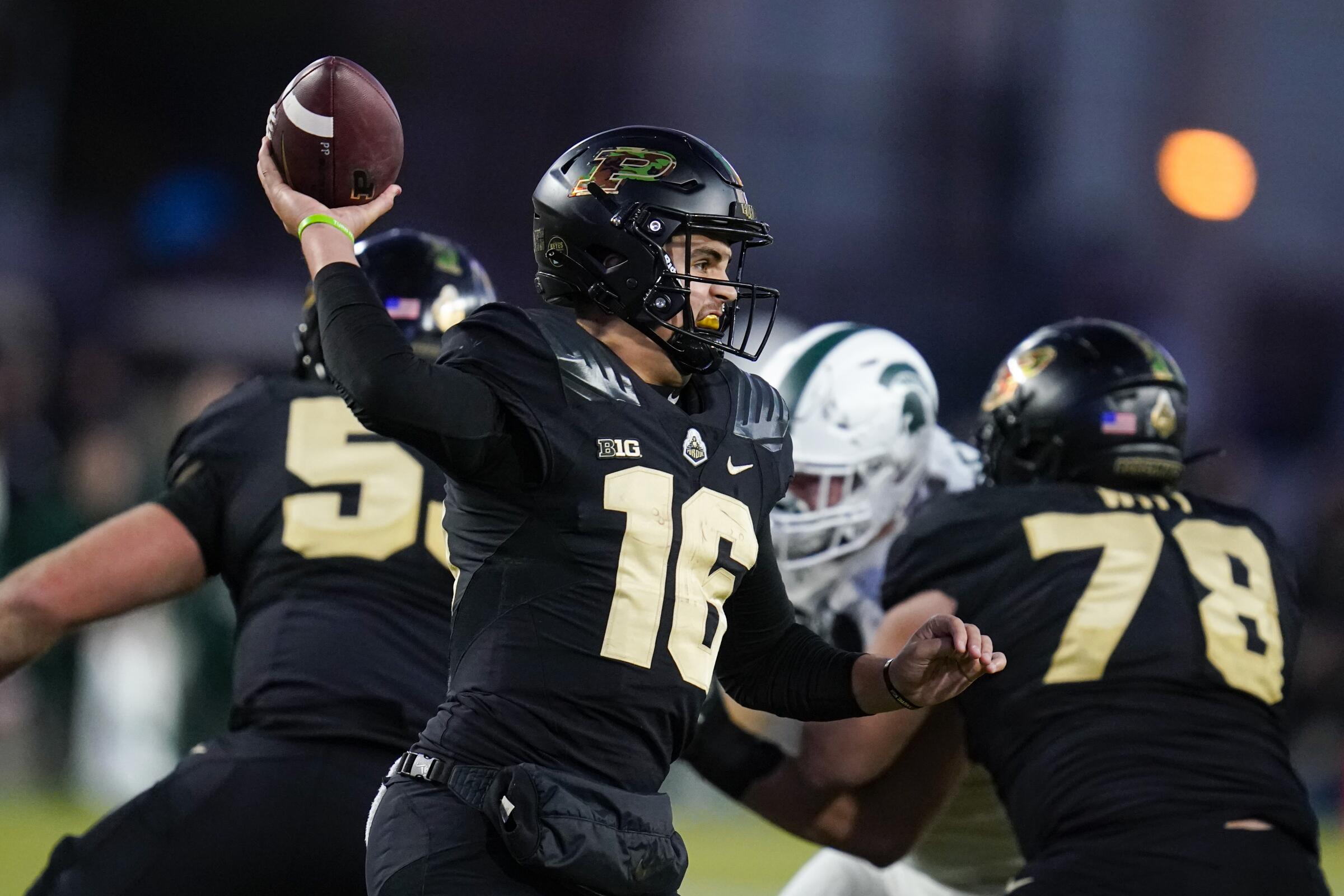 Purdue quarterback Aidan O'Connell (16) throws against Michigan State during the second half.