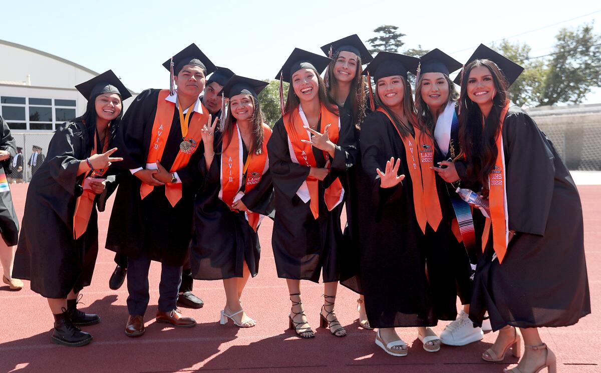 Graduates gather at the Los Amigos High graduation ceremony at Monsoor Stadium in Garden Grove.