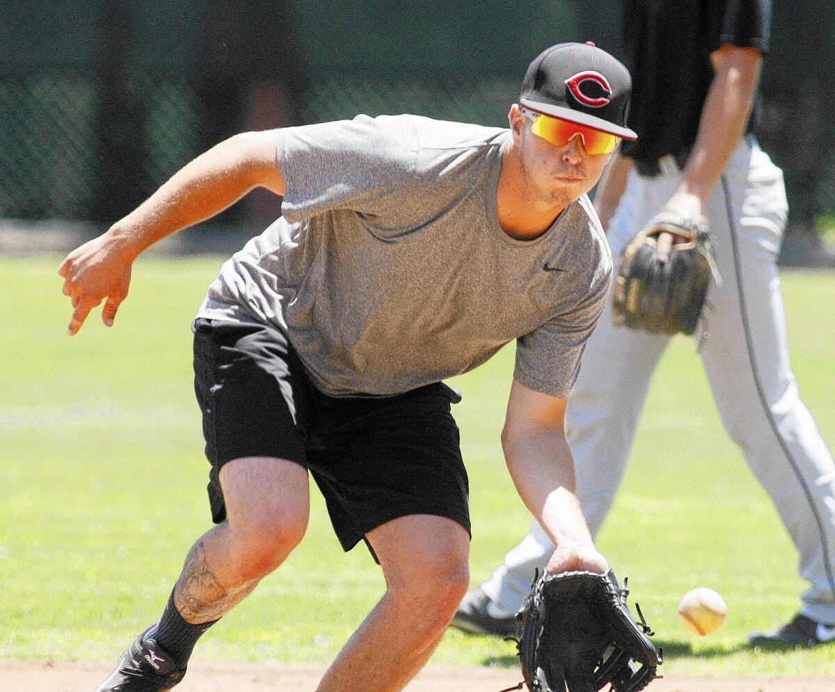 Angelenos' Ruben Padilla, 21, of Chico State, fields the ball during an infield drill at Stengel Field for baseball practice at the start of the 2013 season in Glendale on Wednesday, May 29, 2013.