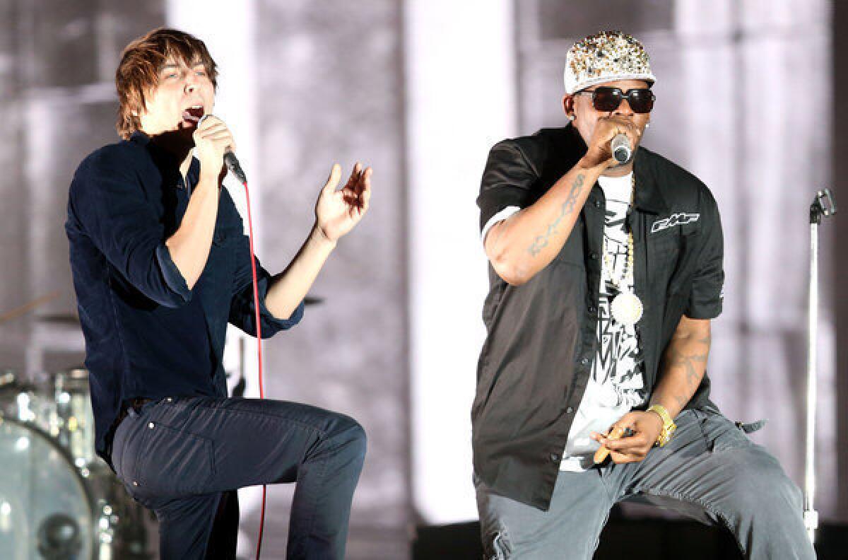 Thomas Mars of the band Phoenix, left, and R. Kelly perform at Coachella.