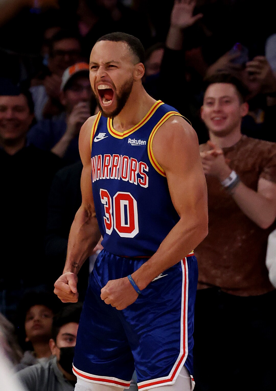Stephen Curry celebrates after making a three-point basket to break Ray Allen’s record for the most all-time 