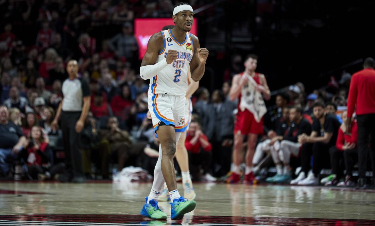 Oklahoma City Thunder guard Shai Gilgeous-Alexander reacts at the end of an NBA basketball game against the Portland Trail Blazers in Portland, Ore., Sunday, March 26, 2023. (AP Photo/Craig Mitchelldyer)
