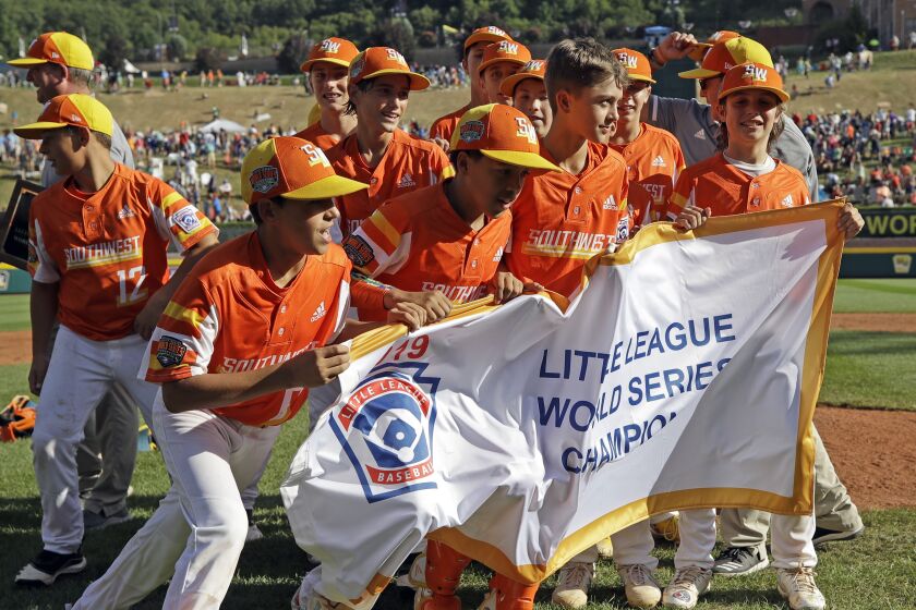 Players from Eastback, La., celebrate after winning the 2019 Little League World Series championship game in South Williamsport, Pa.