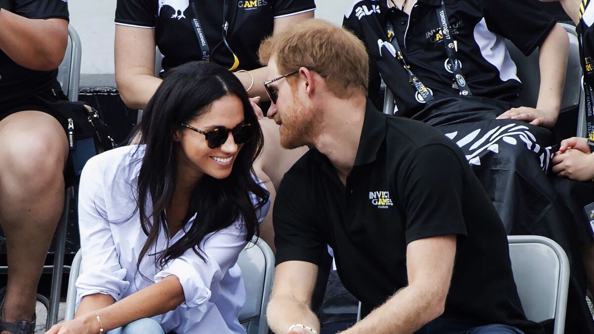 Prince Harry and Meghan Markle attend the wheelchair tennis competition at the Invictus Games.