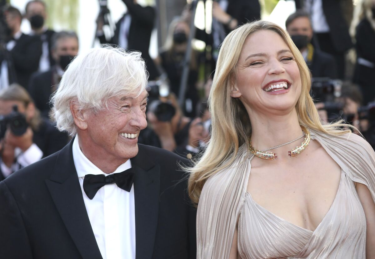 Paul Verhoeven, left, and Virginie Efira pose for photographers upon arrival at the premiere of the film 'Benedetta' at the 74th international film festival, Cannes, southern France, Friday, July 9, 2021. (Photo by Vianney Le Caer/Invision/AP)