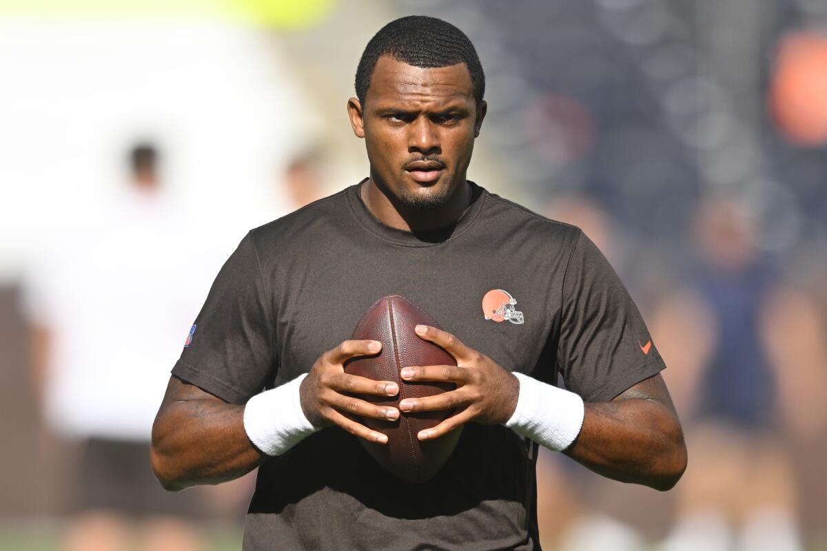 FILE - Cleveland Browns quarterback Deshaun Watson stands on the field before an NFL preseason football game against the Chicago Bears, on Aug. 27, 2022, in Cleveland. Watson can begin practicing on Monday, Nov. 14, 2022, as part of his agreement with the NFL on an 11-game suspension after being accused of sexual misconduct by two dozen women when he played for Houston. (AP Photo/David Richard, File)