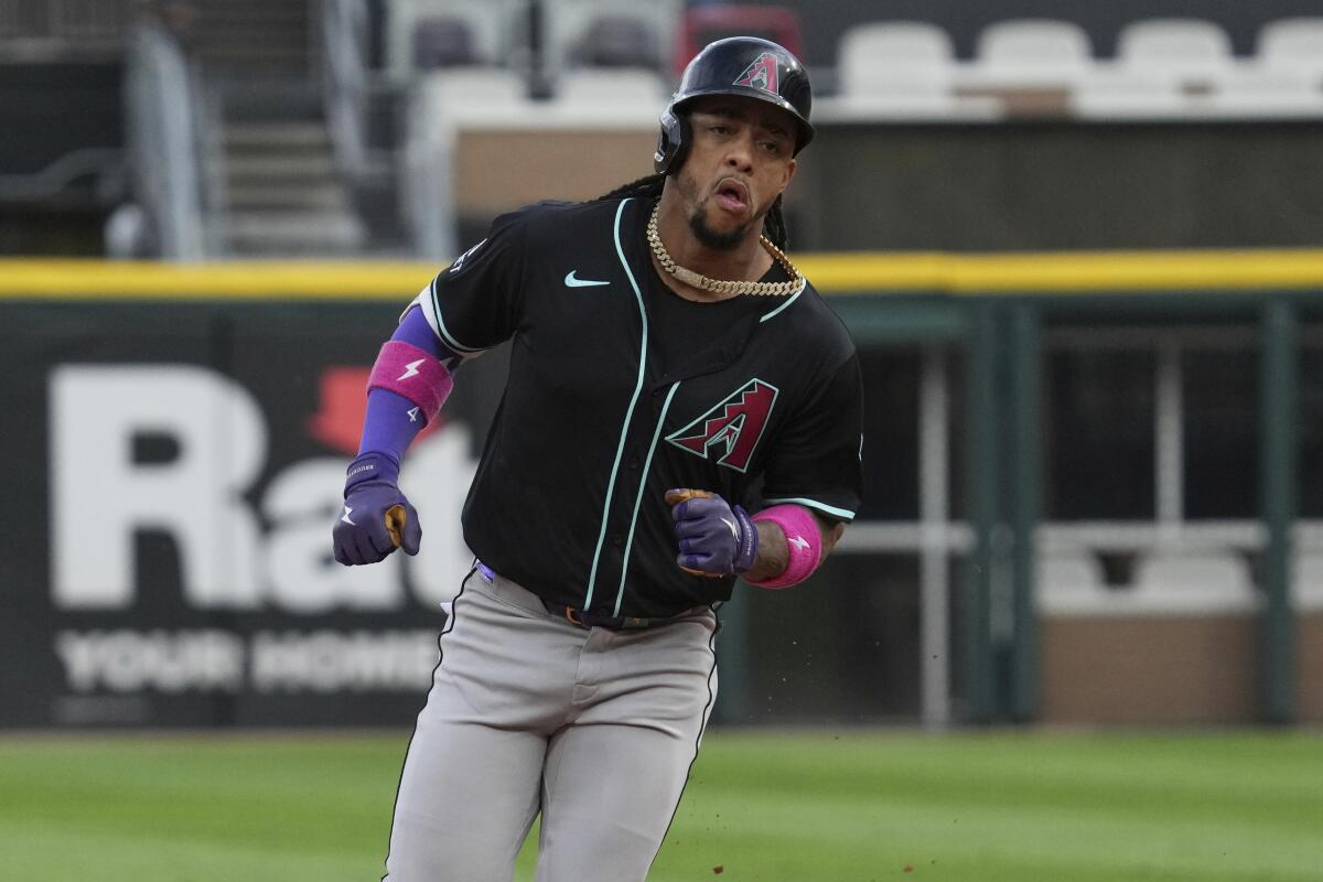 Ketel Marte rounds the bases on a baseball field