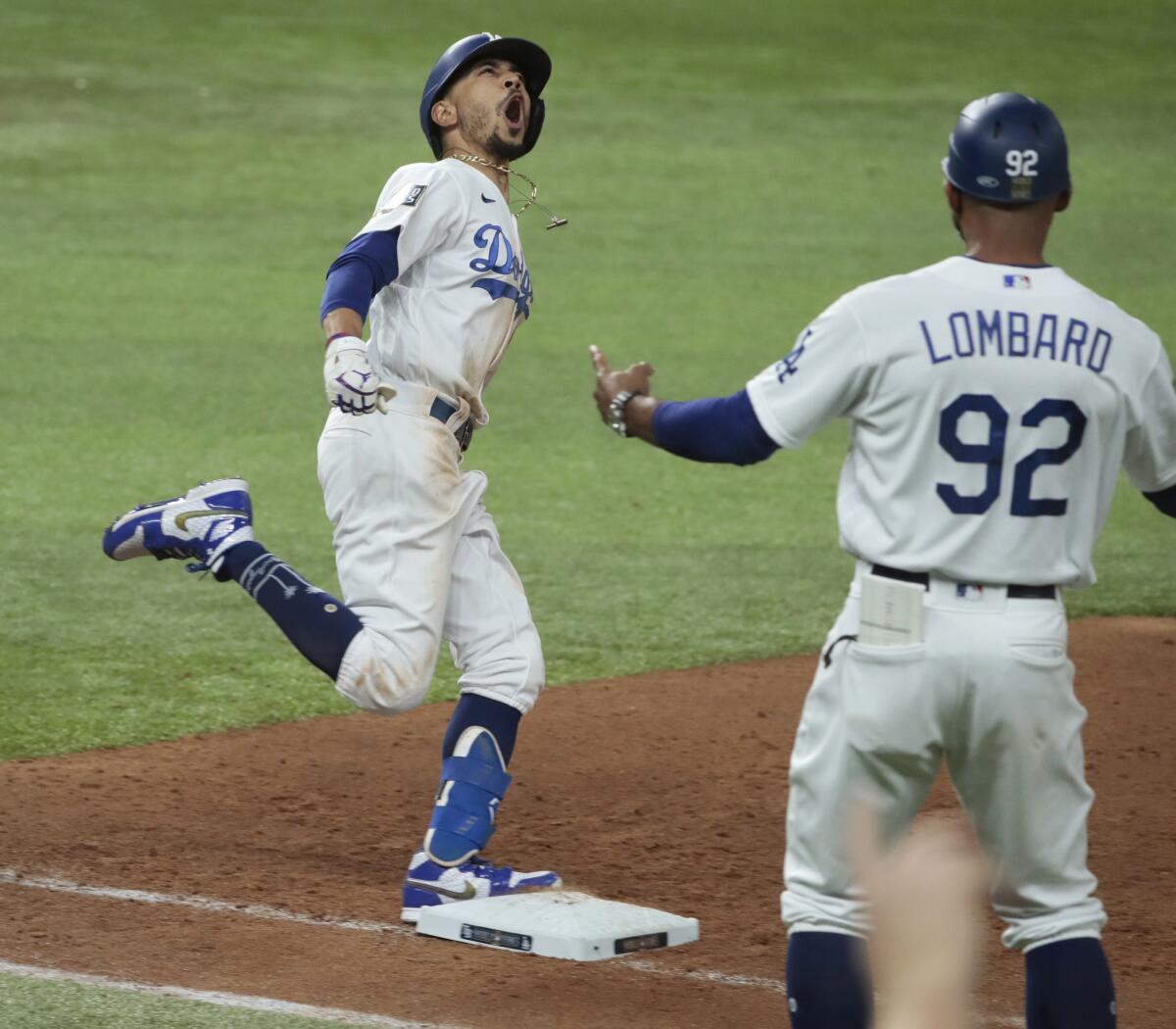 Dodgers' Mookie Betts celebrates after hitting a solo home run in the eighth inning against the Rays.