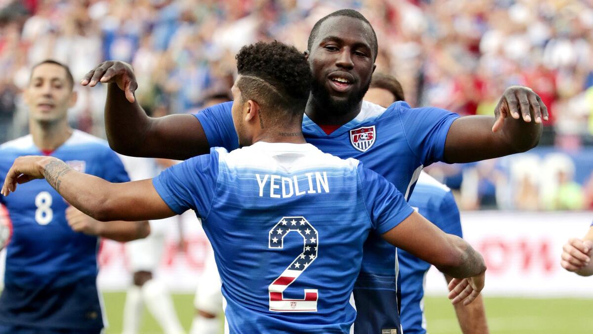 Americans DeAndre Yedlin (2) and Jozy Altidore celebrate after Guatemalaz scored an own goal for the U.S. in the first half of an exhibition game Friday in Nashville, Tenn.