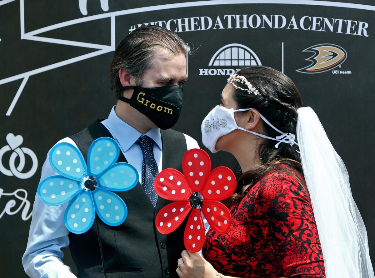 Bride and groom masks for a couple getting married in Anaheim.