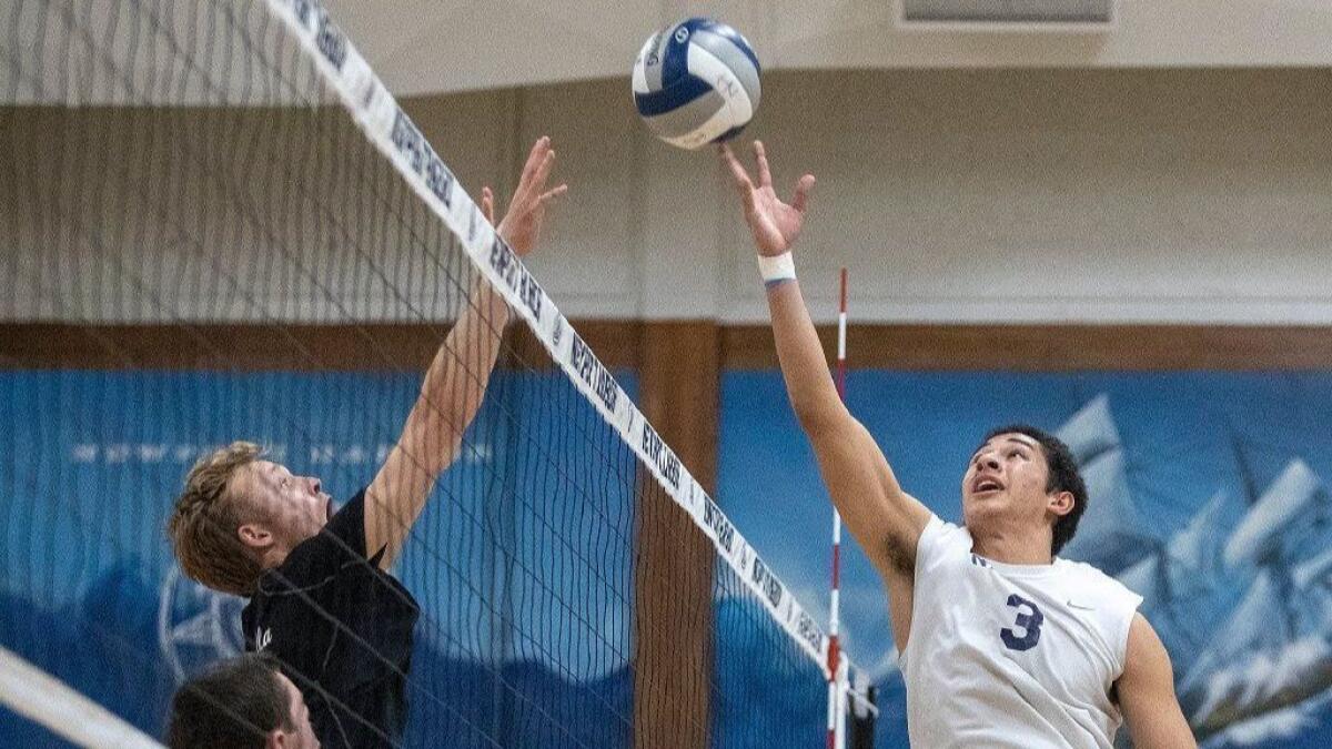 Newport Harbor High''s Joe Karlous, right, seen competing against La Jolla on May 22, has committed to play men's volleyball for Pepperdine University.