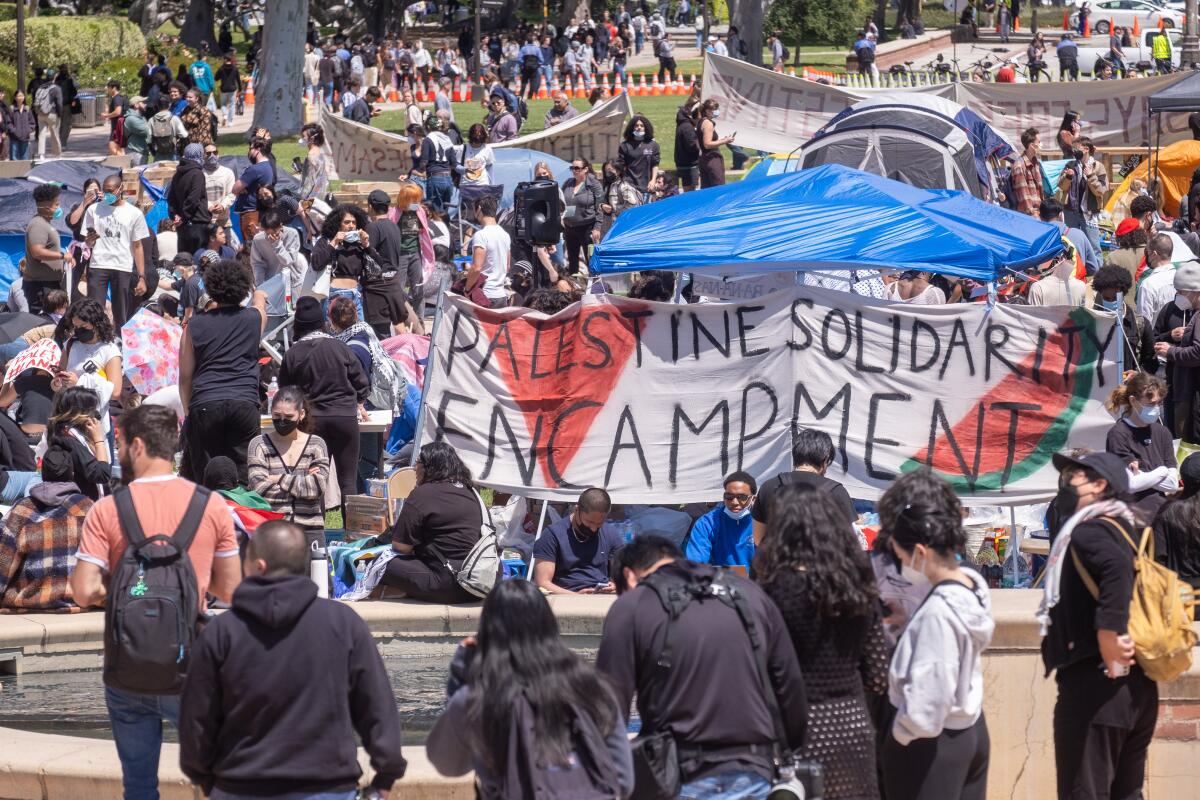 Pro-Palestinian protesters gather at an encampment at UCLA.