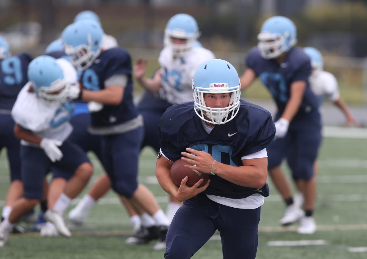 Corona del Mar running back Jason Vicencio, a returning starter, heads up the field during a practice on Aug. 8.