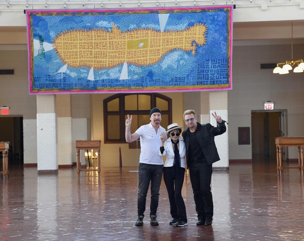 The Edge, Yoko Ono and Bono attend John Lennon Day celebrations on Ellis Island in New York.