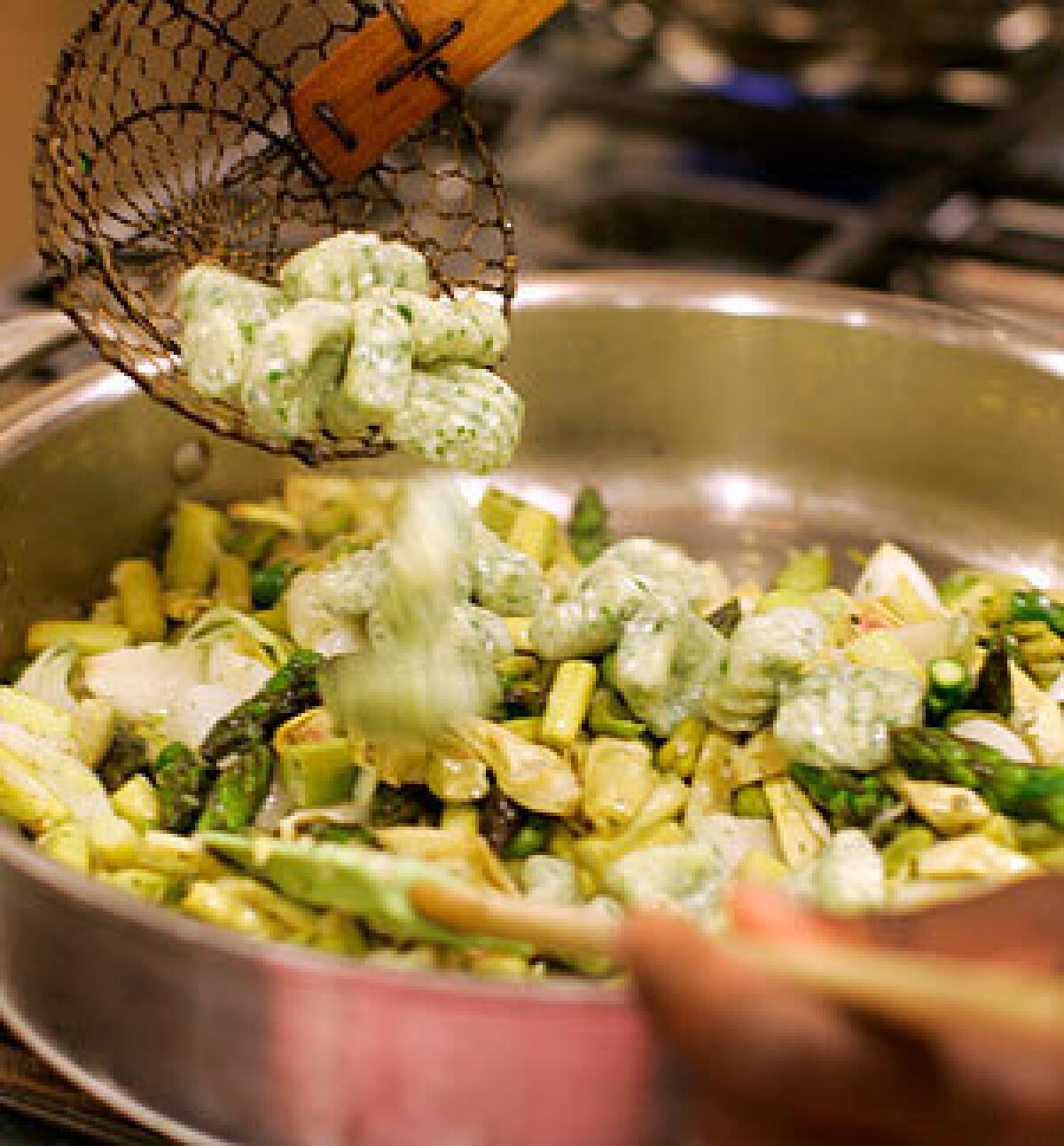 MAIN DISH: Herbed ricotta gnocchi add heft to a spring vegetable stew.