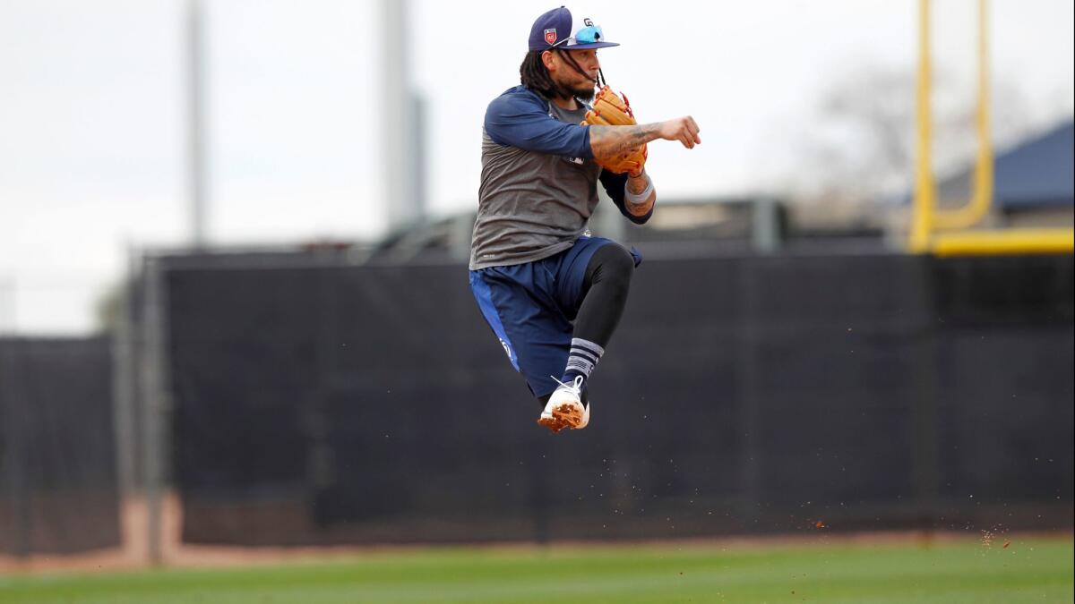 Padres shortstop Freddy Galvis fields a ball during a spring training practice in Peoria on Feb. 15, 2018.