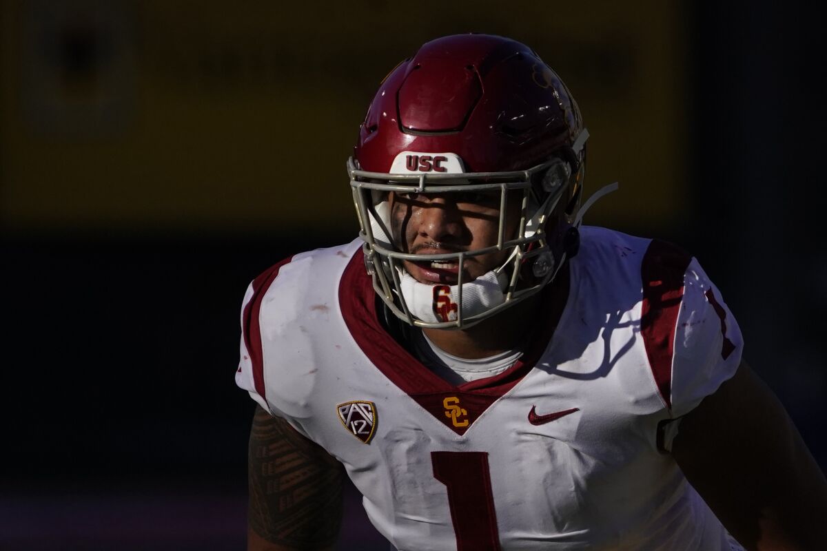 A close-up of Palaie Gaoteote, in USC uniform, on the field.
